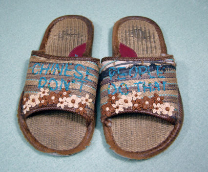 house slippers embellished with embroidery and flowers.